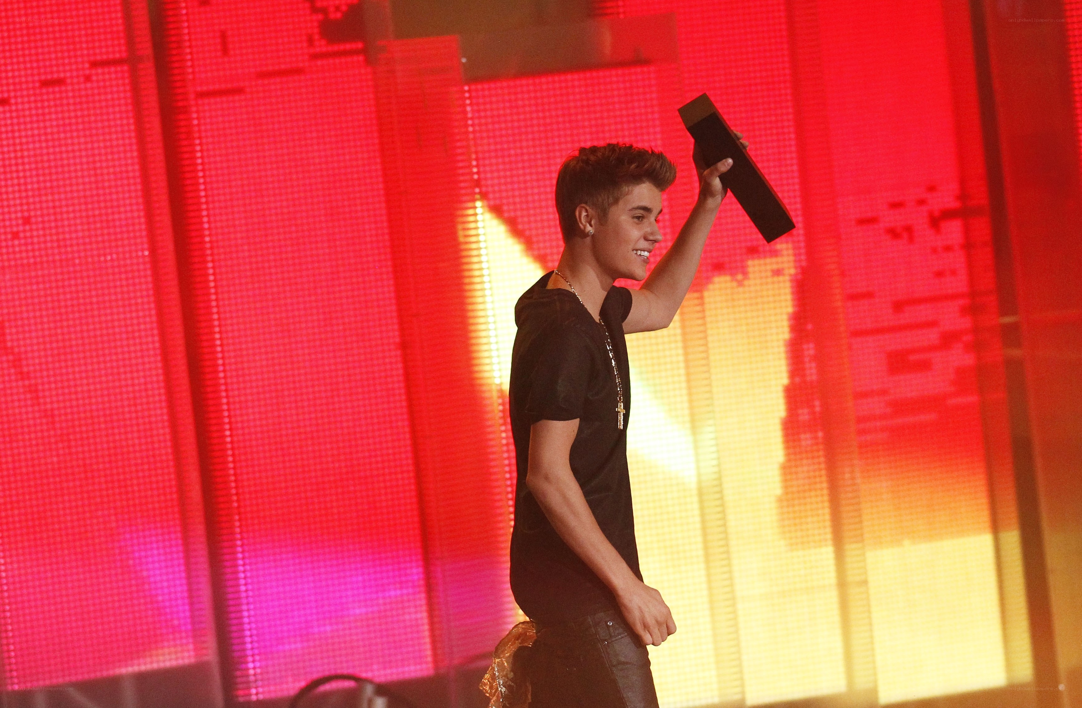 Justin Bieber holding award