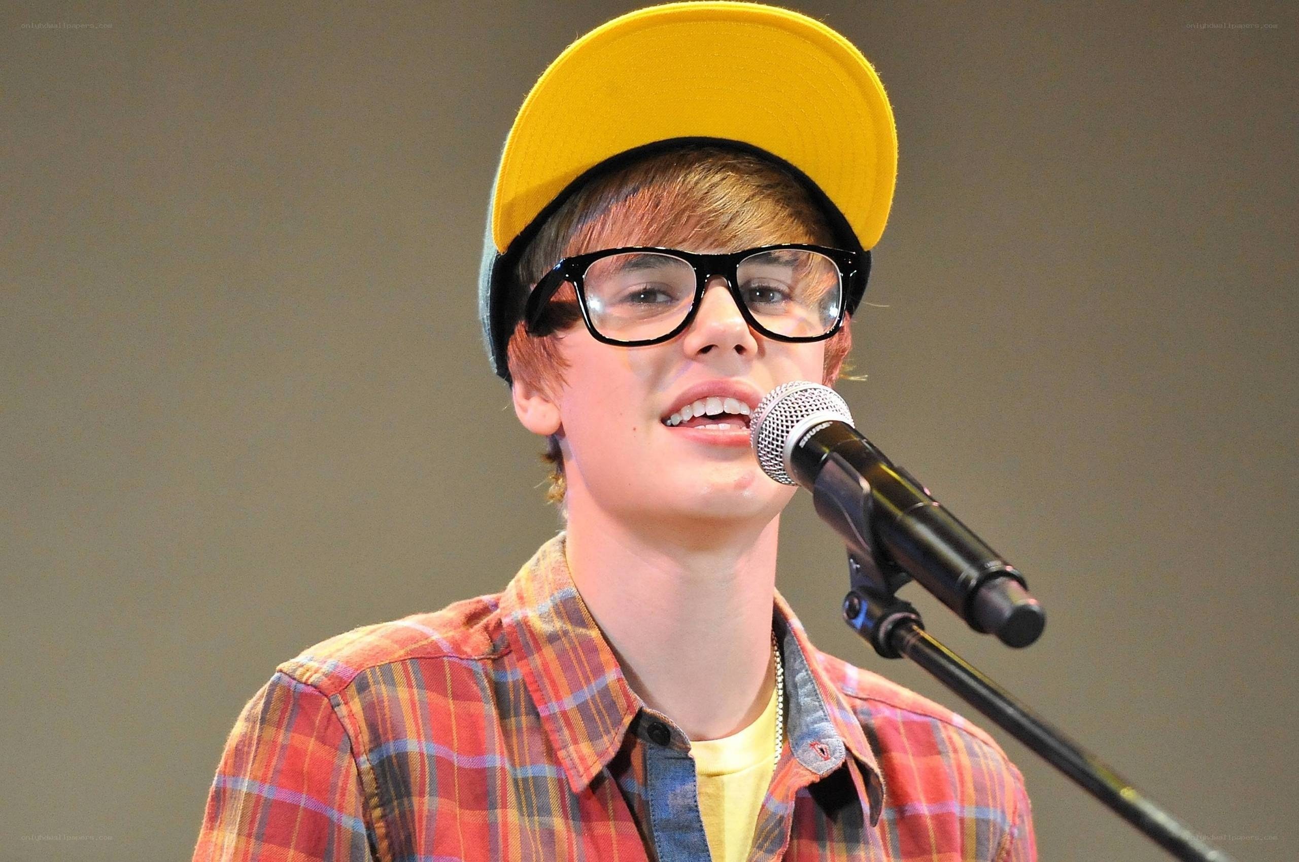 Justin Bieber singing into microphone