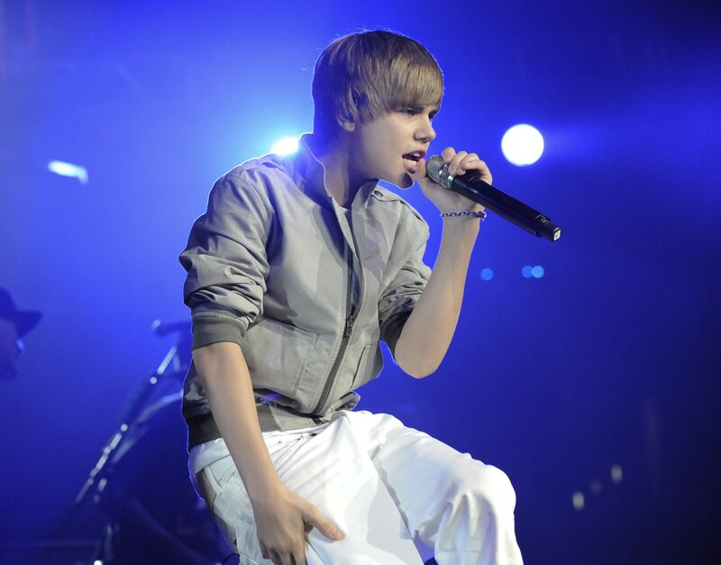 Justin Bieber singing on stage