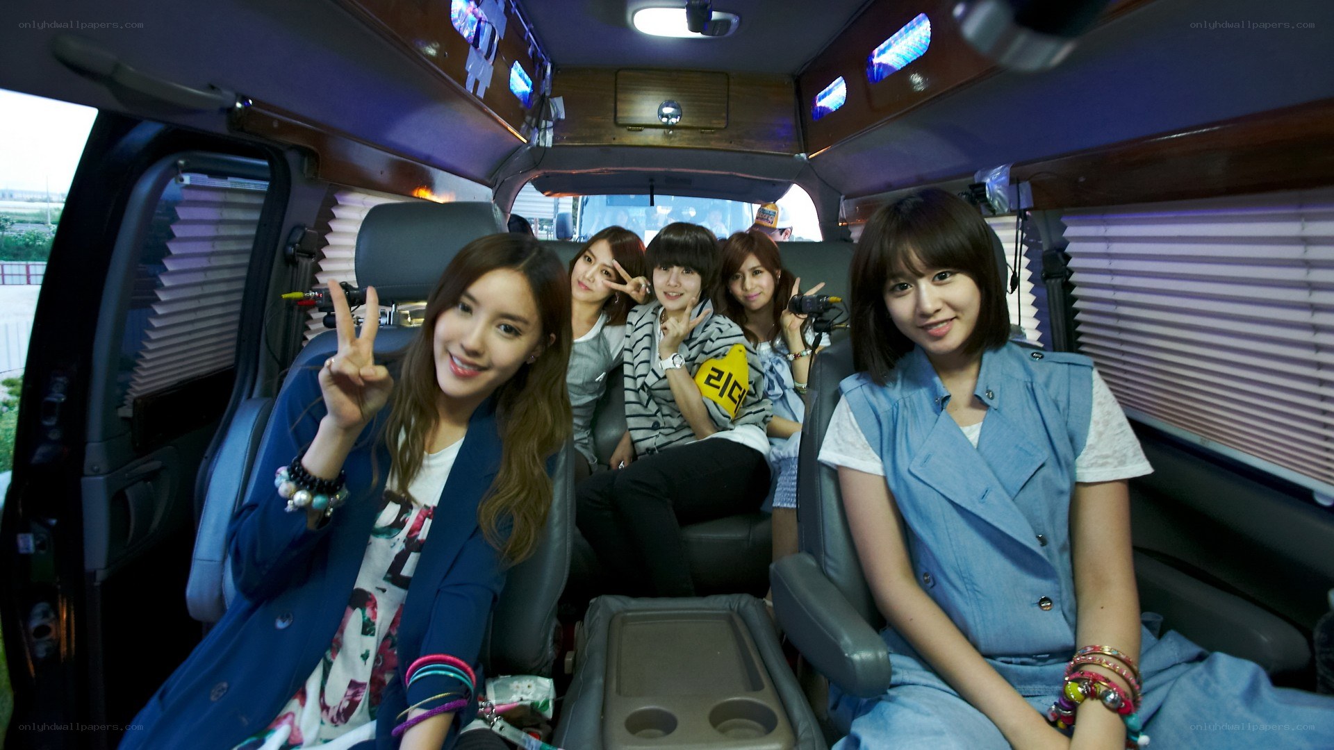 K-pop group in a van
