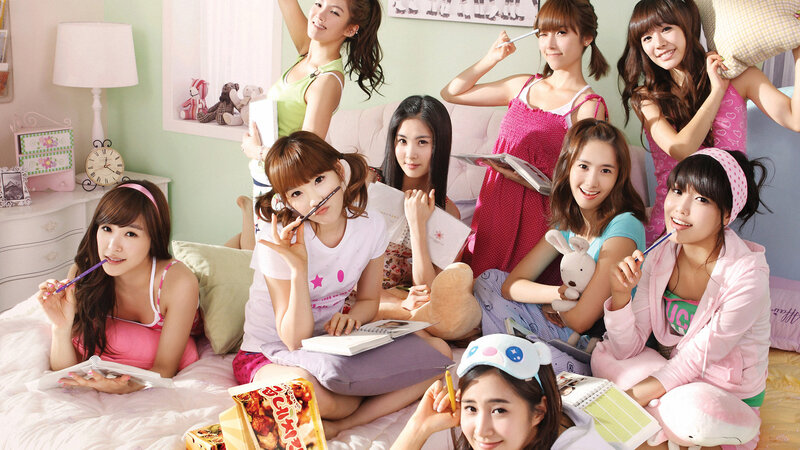 K-pop group in bedroom