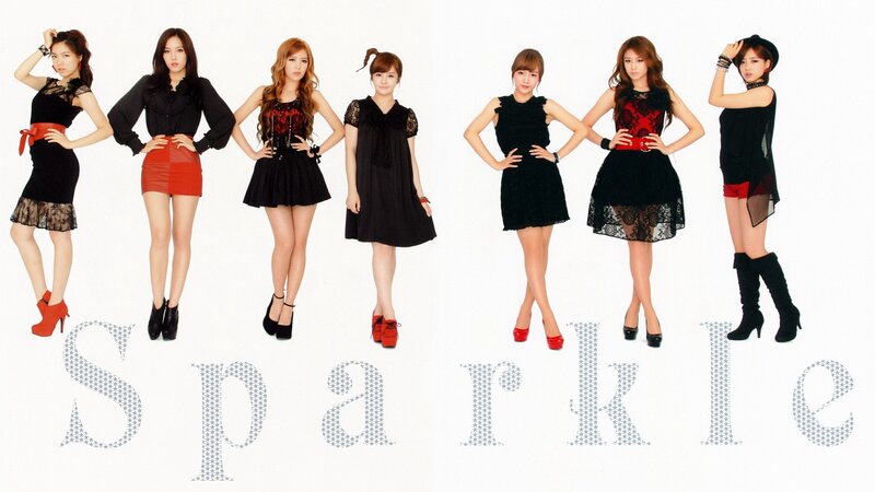 K-pop group in black and red outfits