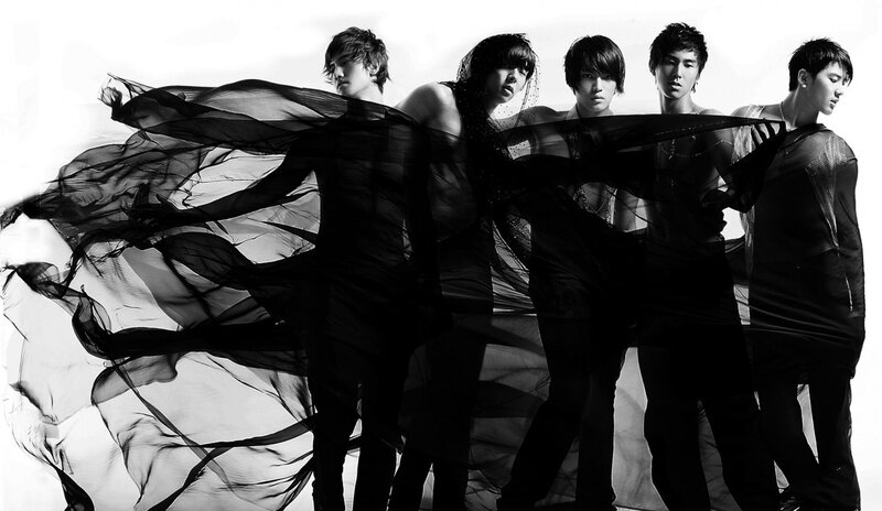 K-pop group in black and white