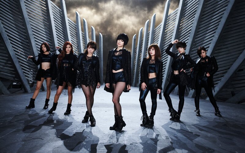 K-pop group in black outfits