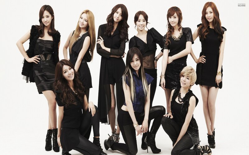 K-pop group in black outfits