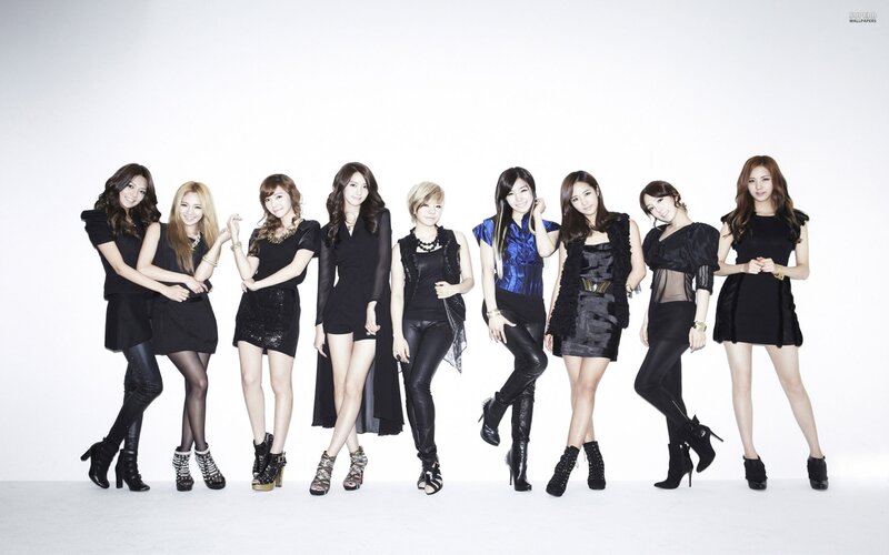 K-pop group in black outfits