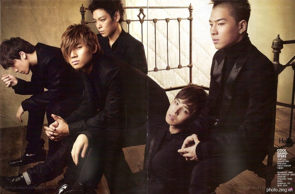 K-pop group in black suits