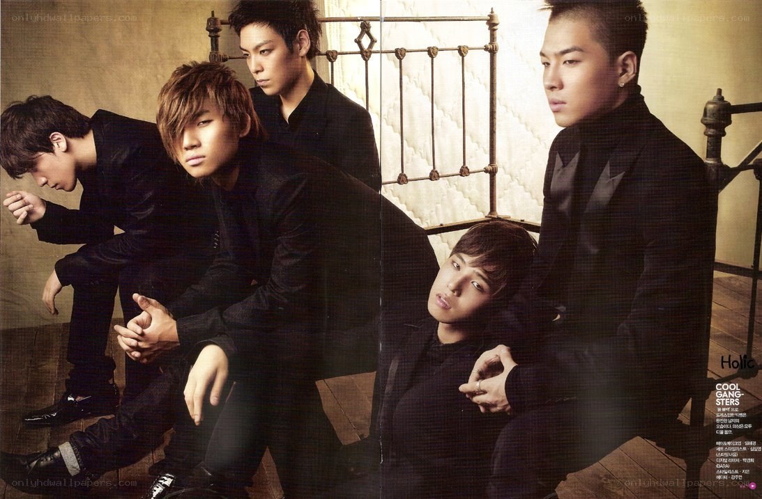 K-pop group in black suits