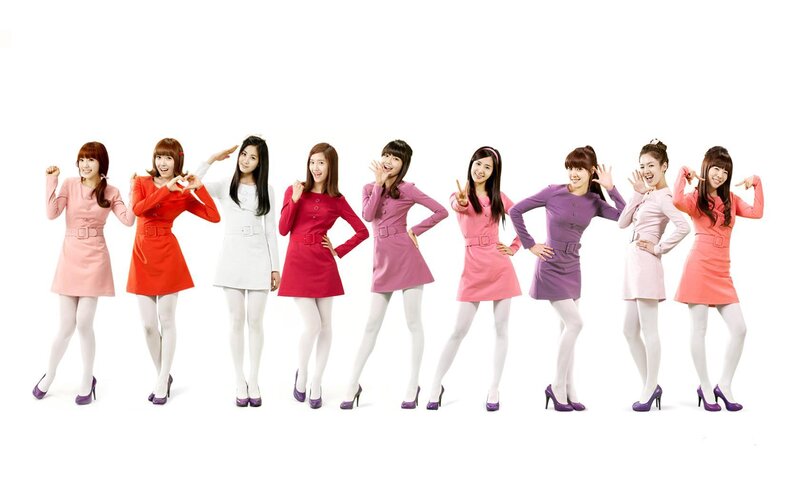 K-pop group in colorful dresses