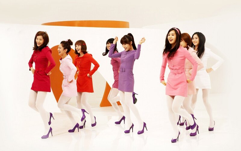 K-pop group in colorful dresses