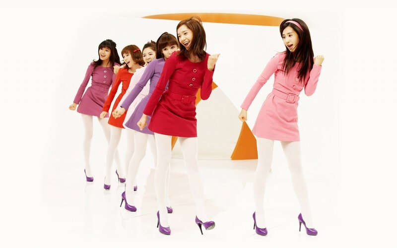 K-pop group in colorful dresses