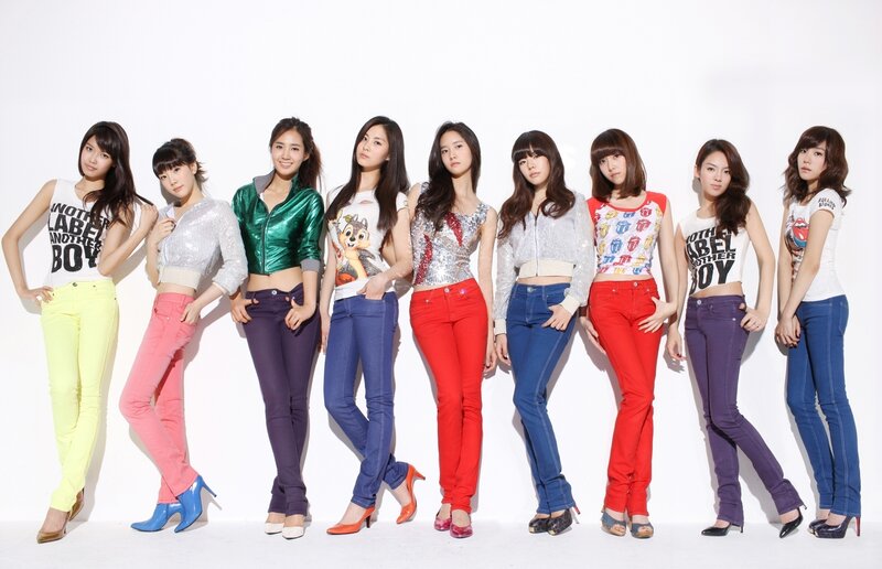 K-pop group in colorful jeans