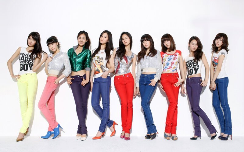 K-pop group in colorful jeans