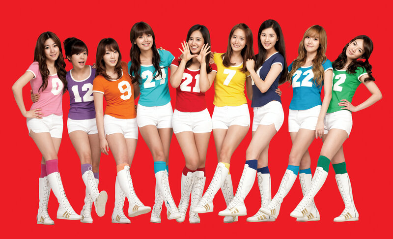 K-pop group in colorful jerseys