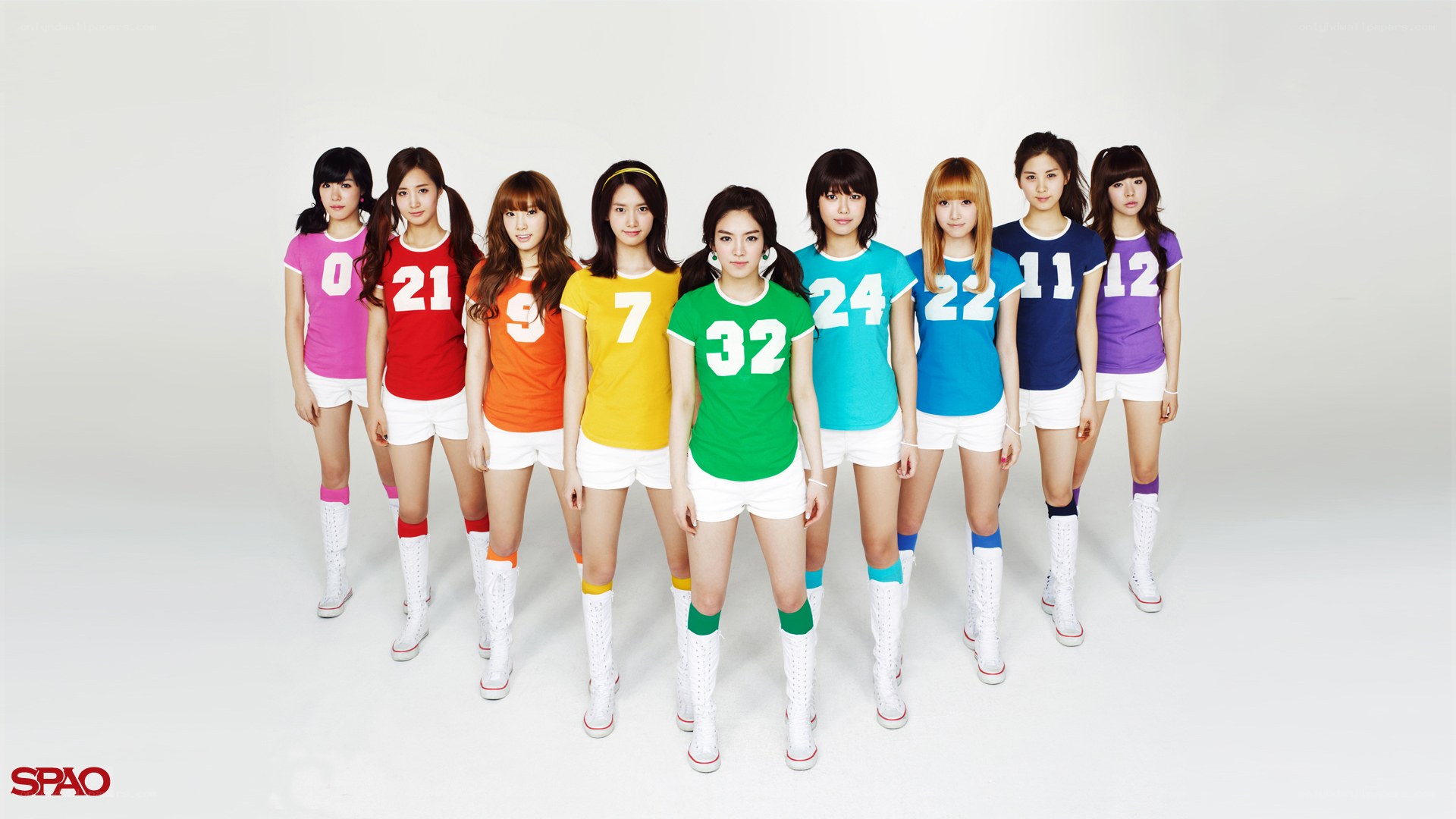 K-pop group in colorful jerseys