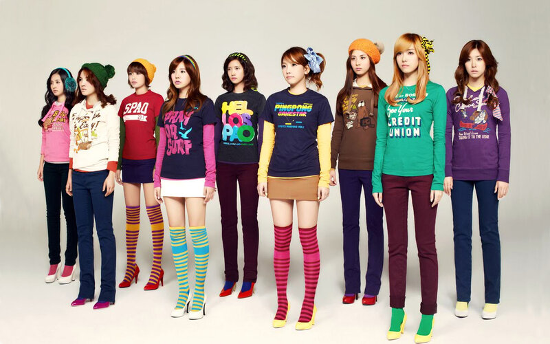 K-pop group in colorful outfits