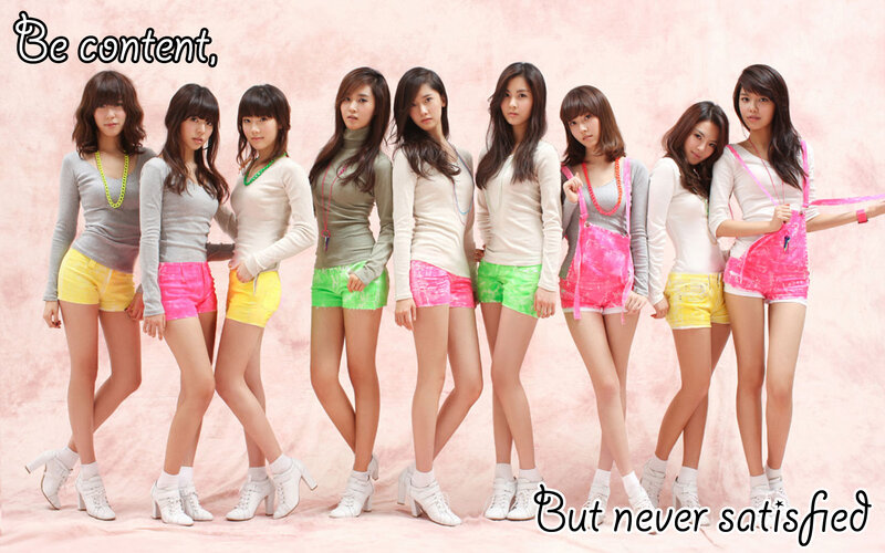 K-pop group in colorful outfits