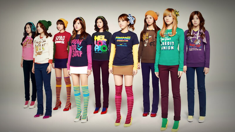 K-pop group in colorful outfits