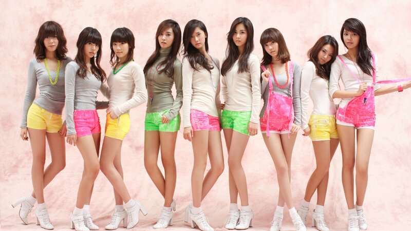 K-pop group in colorful outfits