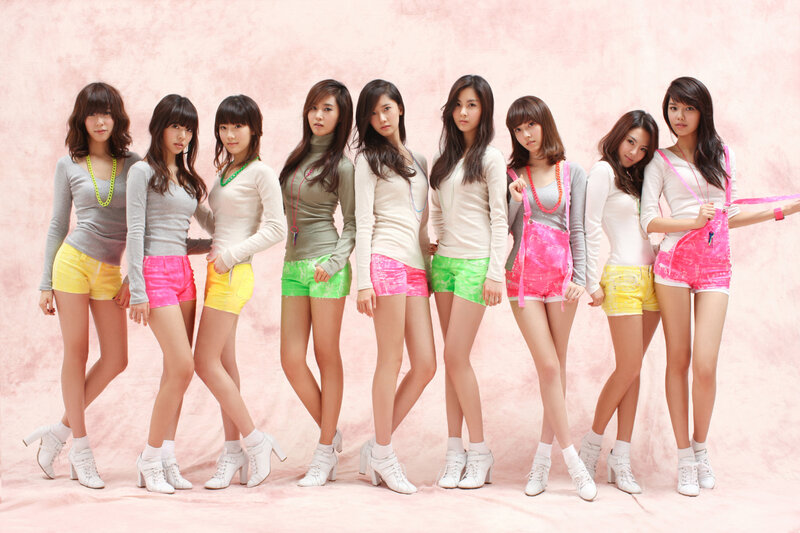 K-pop group in colorful outfits