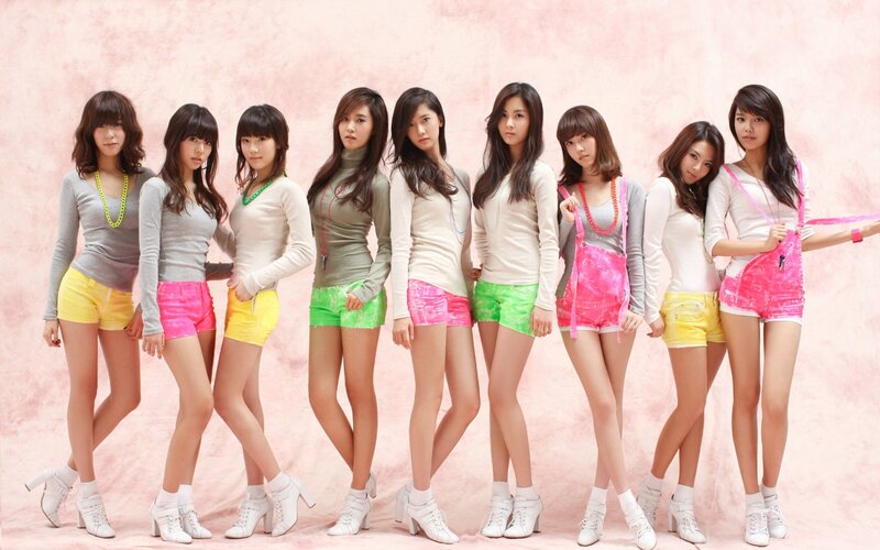 K-pop group in colorful outfits
