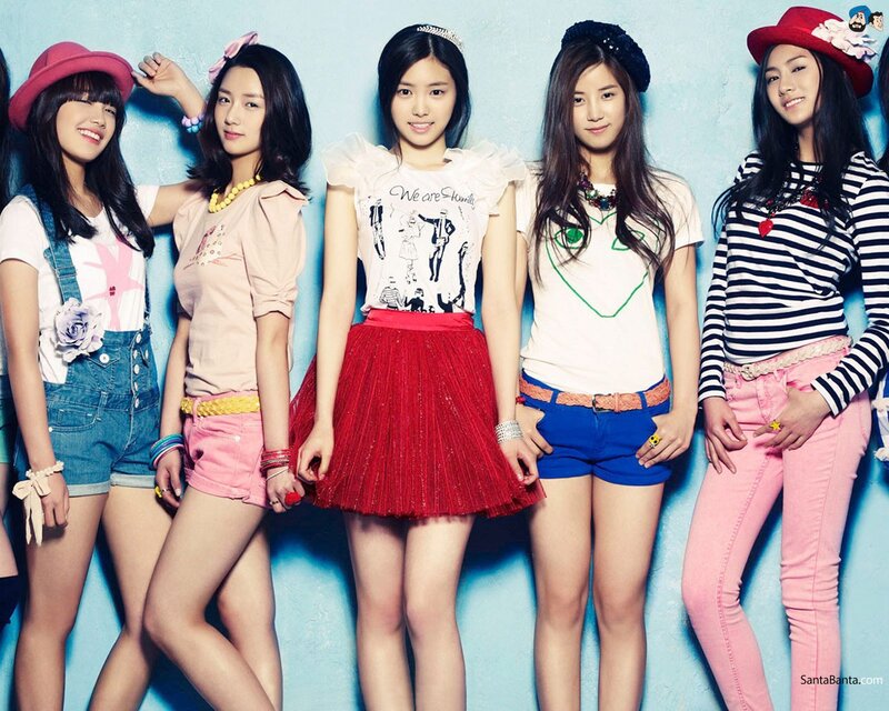 K-pop group in colorful outfits