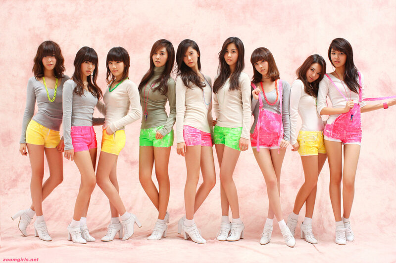 K-pop group in colorful outfits