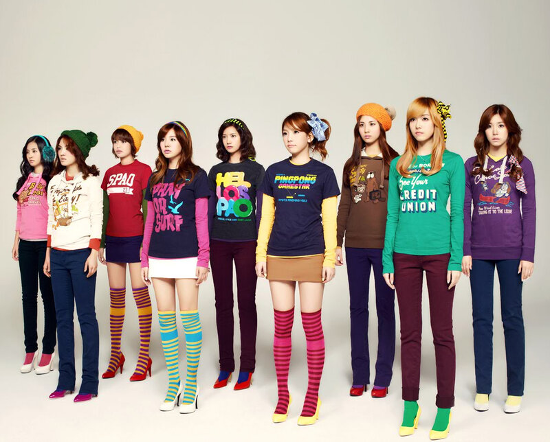 K-pop group in colorful outfits