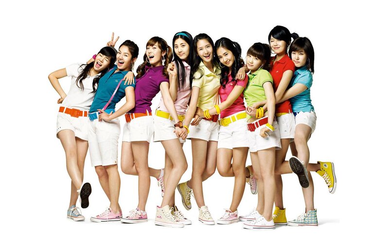 K-pop group in colorful outfits