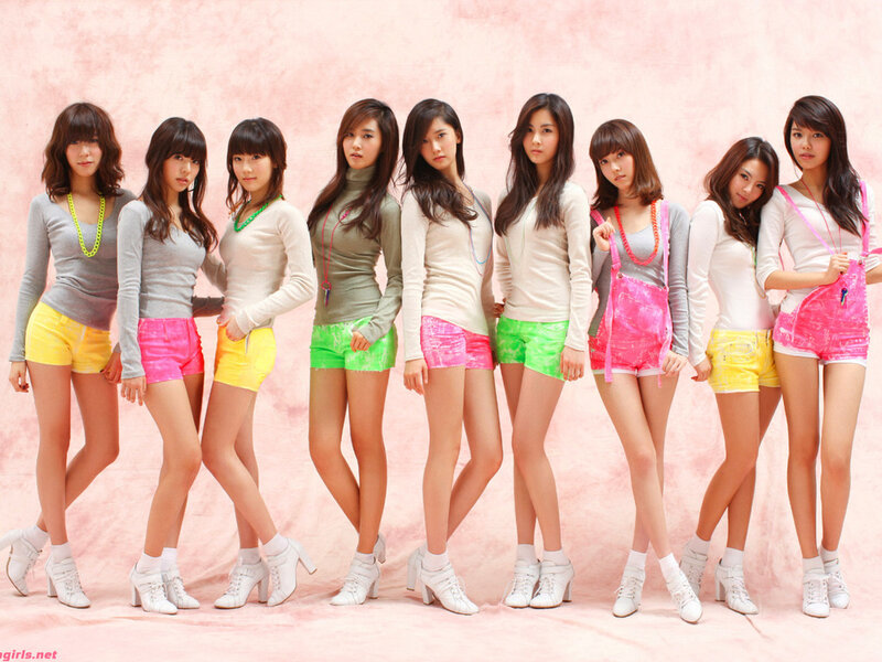 K-pop group in colorful outfits