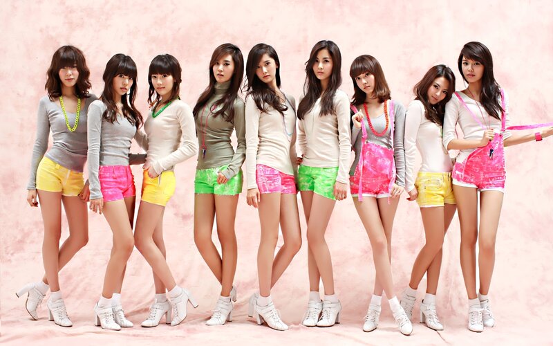 K-pop group in colorful outfits