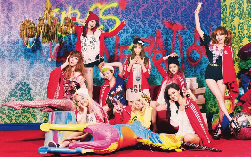 K-pop group in colorful studio