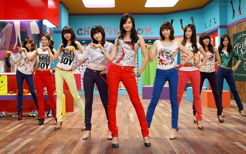 K-pop group in colorful studio