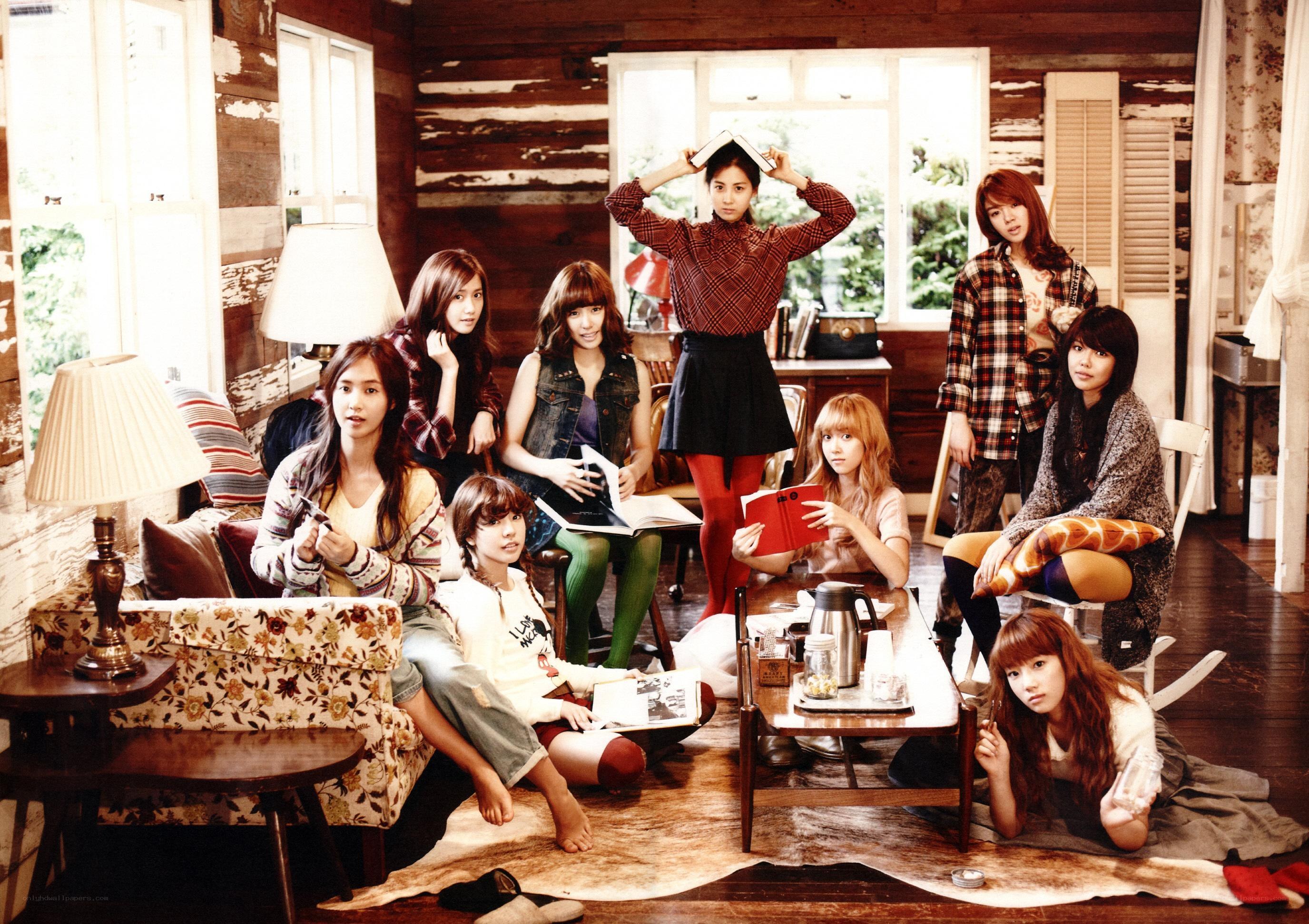 K-pop group in cozy cabin
