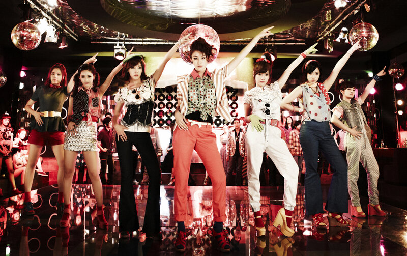 K-pop group in disco setting
