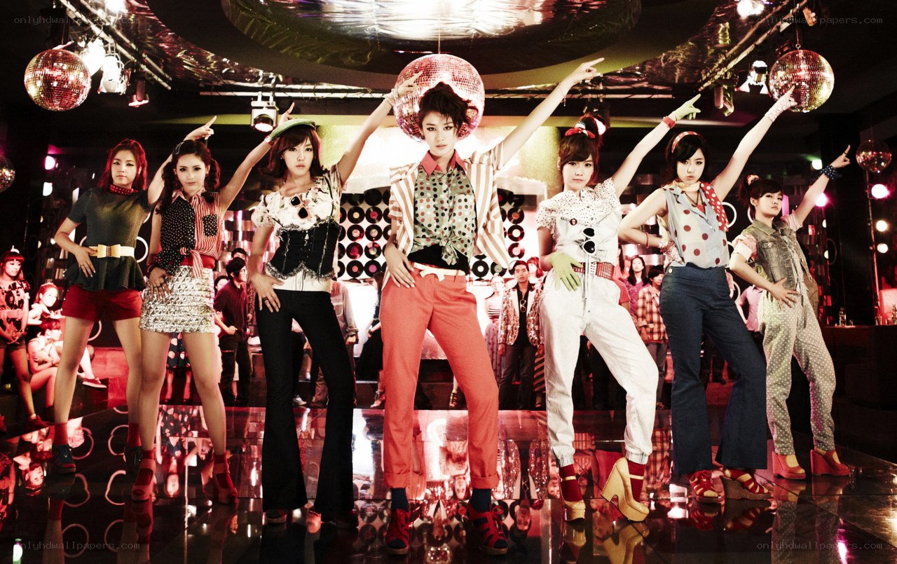 K-pop group in disco setting