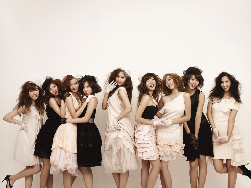 K-pop group in elegant dresses