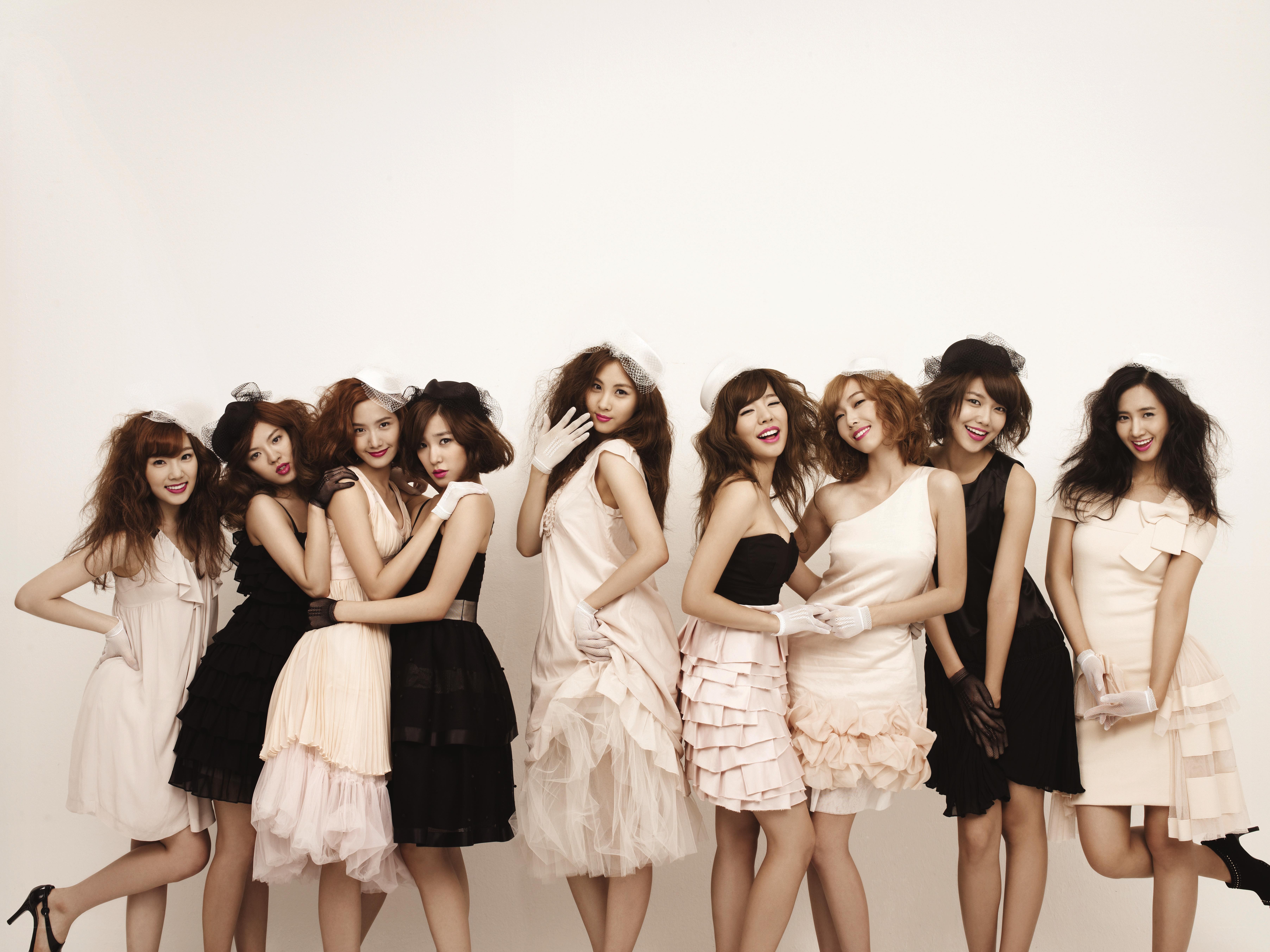 K-pop group in elegant dresses