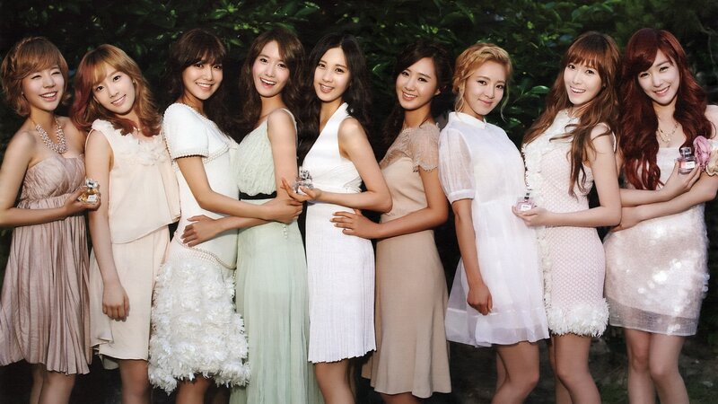 K-pop group in elegant dresses