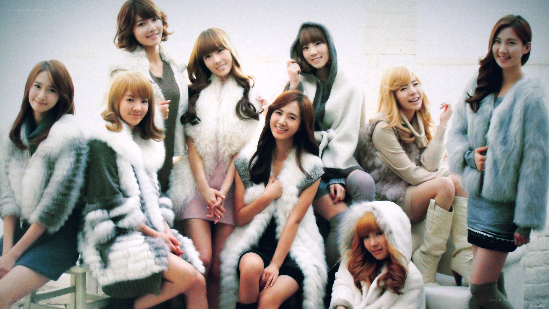 K-pop group in fur coats