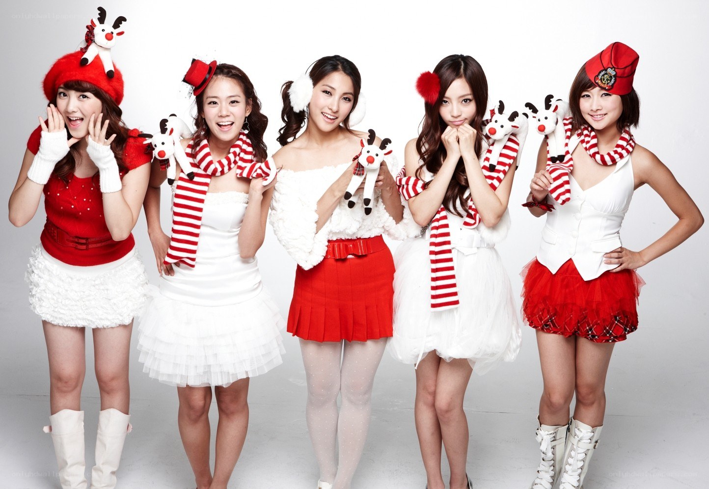 K-pop group in holiday outfits