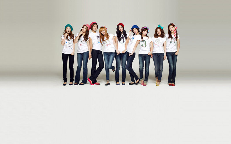K-pop group in matching outfits