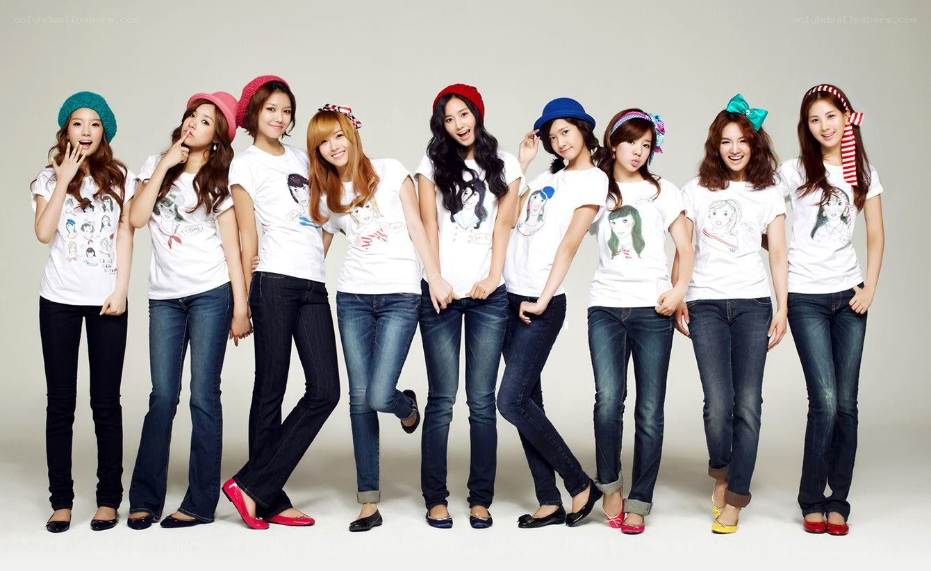 K-pop group in matching outfits
