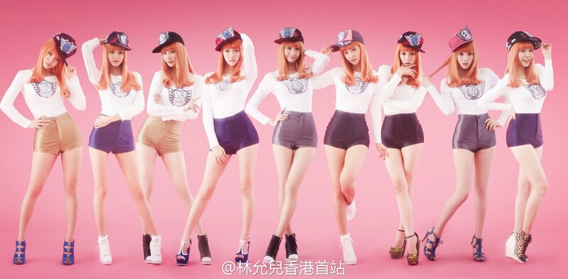 K-pop group in matching outfits