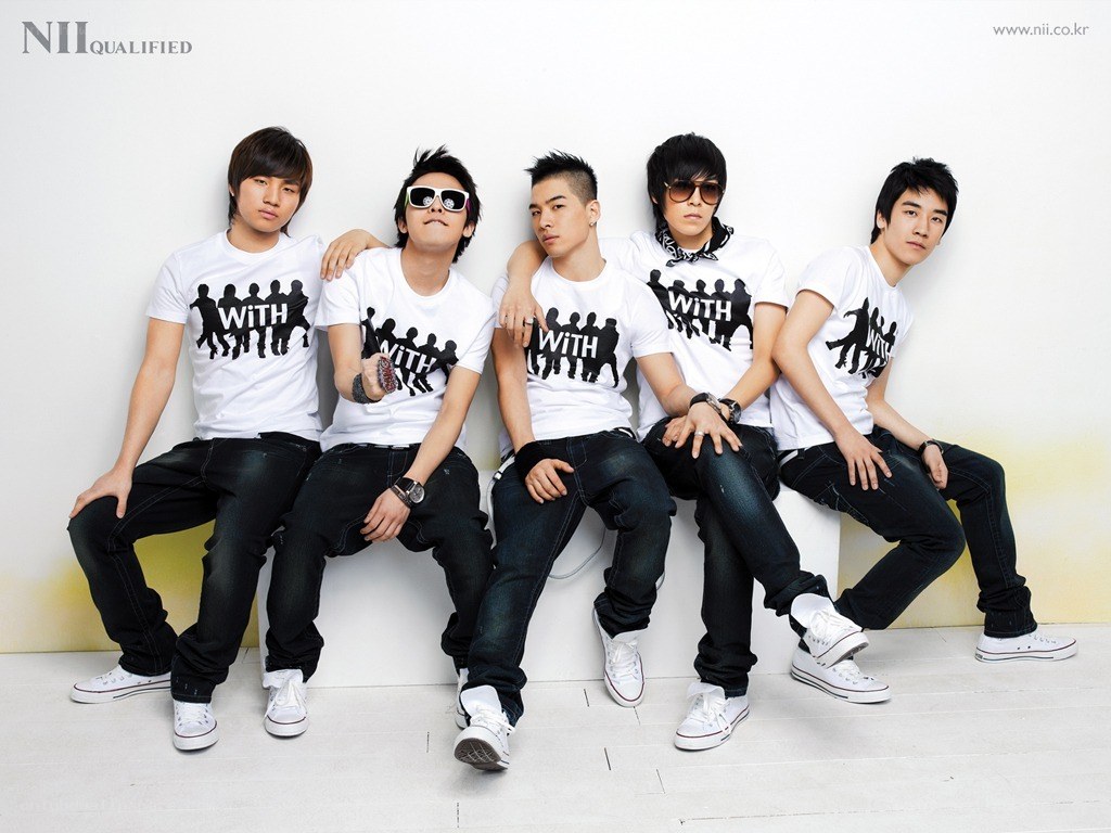 K-pop group in matching shirts