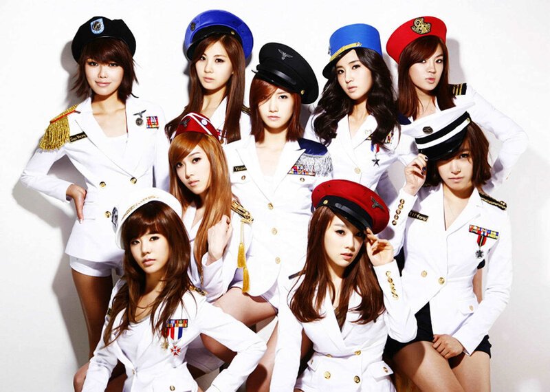 K-pop group in military-style uniforms