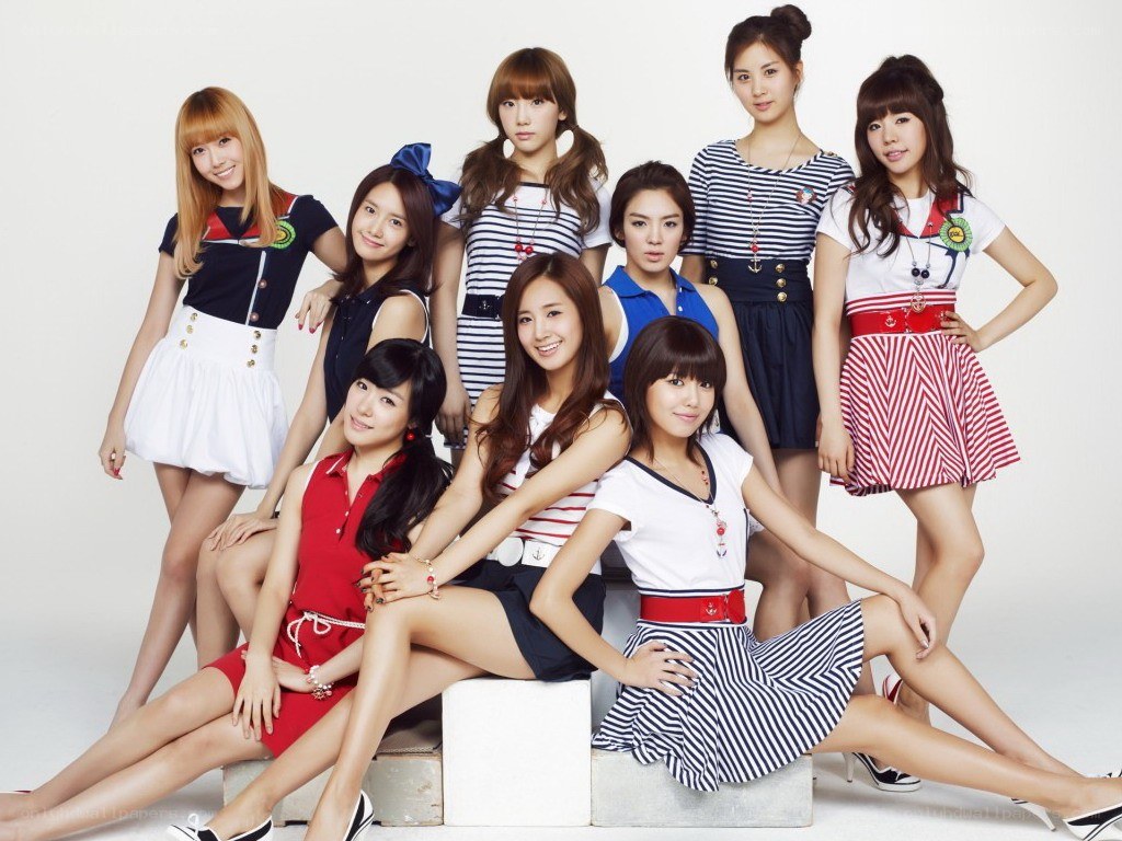 K-pop group in nautical outfits
