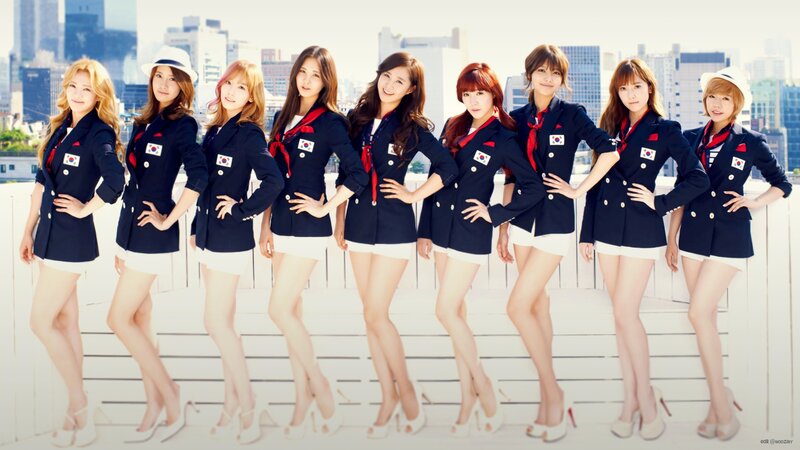 K-pop group in navy uniforms