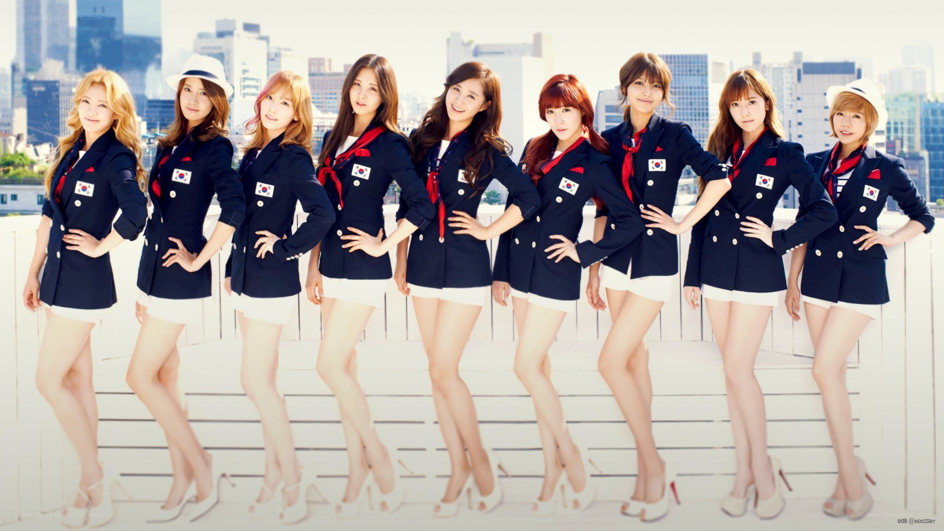 K-pop group in navy uniforms