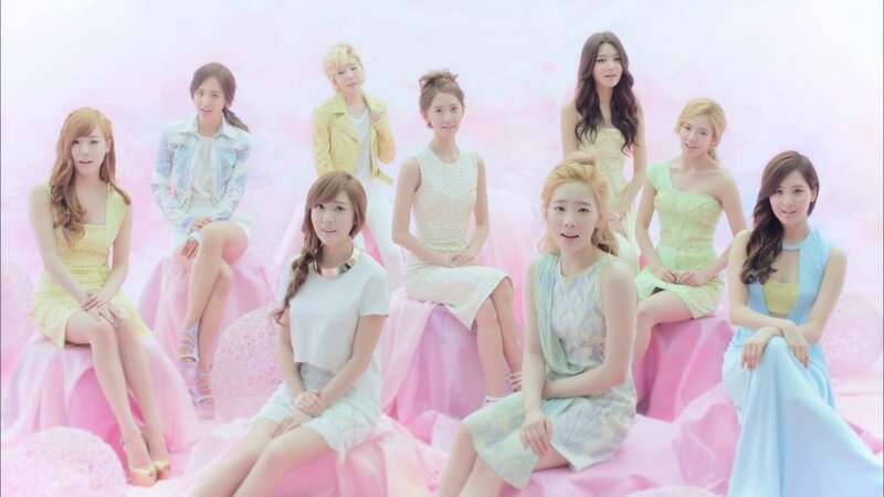 K-pop group in pastel dresses